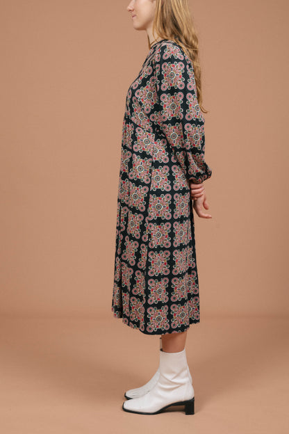 Vintage long sleeved black and multi-coloured maxi dress with geometric pattern side view - Lemon Lane Vintage