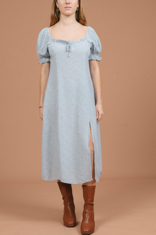 Vintage blue floral midi dress with puffy cap sleeves, ruffle detailing, and front bow front view - Lemon Lane Vintage