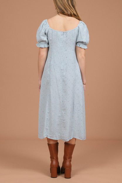 Vintage blue floral midi dress with puffy cap sleeves, ruffle detailing, and front bow back view - Lemon Lane Vintage