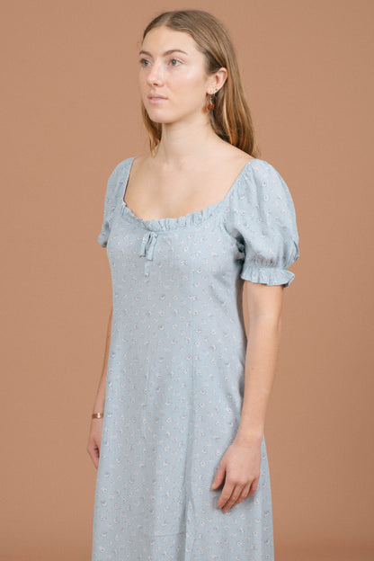 Vintage blue floral midi dress puffy cap sleeve, ruffle neckline, and fabric texture detail - Lemon Lane Vintage