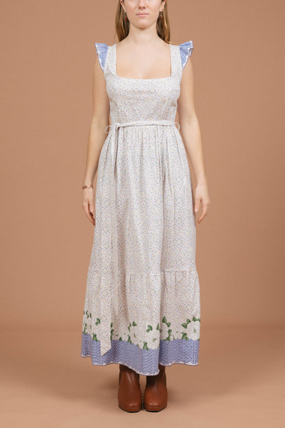 Vintage floral and polkadot prairie cottage core maxi dress with ruffle detailing in white and multi-coloured fabric front view - Lemon Lane Vintage