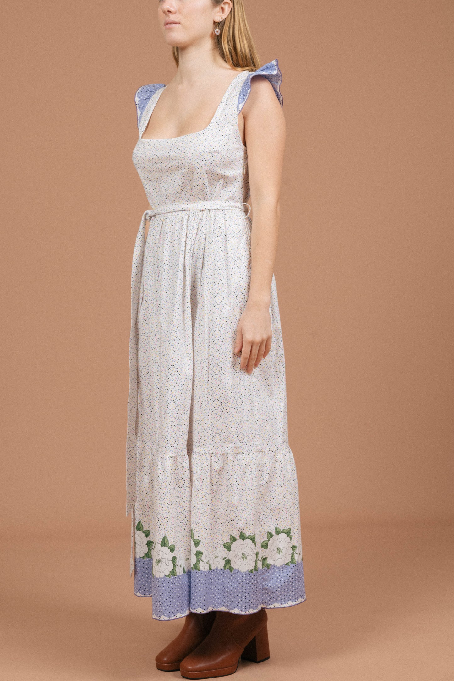 Vintage floral and polkadot prairie cottage core maxi dress with ruffle detailing in white and multi-coloured fabric side view - Lemon Lane Vintage
